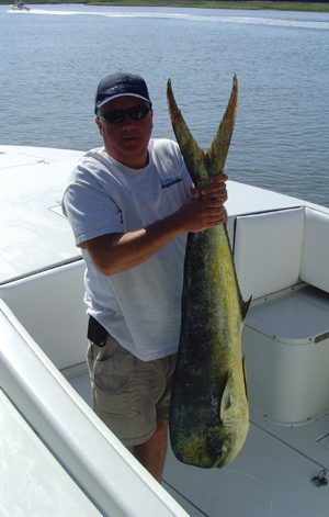Tom Clayton, of Manasquan, NJ, with a 30 lb. dolphin caught at the Blackjack Hole aboard The GPS Store Fishing Team’s 31′ Contender. The dolphin fell for a blue/white Ilander behind a pink bird.