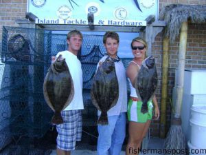 Austin Eubank, John Theodorakis, and Margaret Pennstrom with 5.5, 5, and 4.8 lb flounder caught on live baits near Southport aboard the "Clearly Hooked." Photo courtesy of Island Tackle and Hardware.