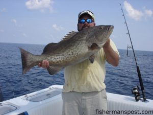 Ken Broomfield with a 27.9 lb. gag grouper caught on a butterfly jig at the Steeples while fishing aboard the "Fish Hooker."