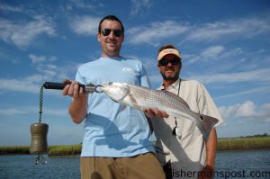 Max Gaspeny and Capt. Mike Pedersen, of No Excuses Charters, with a slot red drum that fell for a Gulp Shrimp near an oyster bed just off the ICW near Topsail.