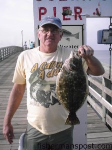 Larry Kiker with a 3 lb. 4 oz. summer flounder caught while fishing from Ocean Crest Pier. The fish takes the top spot so far in the flounder category of OCP's yearly contest.