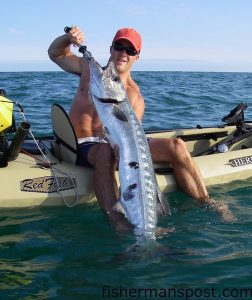 Ryan Hunnicut, of Wilmington, with a  58" barracuda he hooked and released just a mile off Wrightsville on a live bluefish while fishing with Nate Watson.