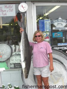 Donna McGuire, of Morehead City, with a 44 lb. citation cobia caught on a dead bait while bottom fishing on the east side of Lookout Shoals. Photo courtesy of Freeman's Bait & Tackle.