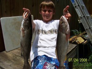 Christian Stiller with a speckled trout and a gray trout caught on live shrimp near the Southport waterfront. He was fishing with Capt. Vanessa Martin of Nauti-Girl Charters.
