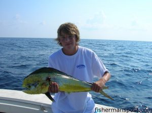 Matthew Gilgo (age 13), of Scott's HIll, NC, with his first dolphin. He hooked it on a chartreuse-skirted ballyhoo while fishing with his father near 23 Mile Rock.