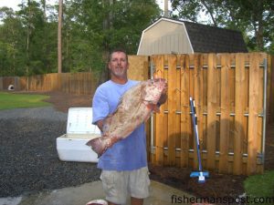 J.R. Melvin with a 20 lb. red grouper taken 55 miles off Masonboro Inlet while fishing aboard the "FishZilla."