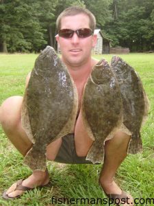 Jason Clark, of Hillsborough, NC, poses with three flounder he caught in the ICW at Topsail Beach.