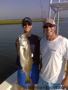 Scotty Gould and Chris Pope with a near-7 lb. speckled trout caught on a Skitterwalk in the lower Cape Fear River while fishing with Douglas Cutting.