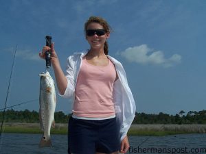 Ellen, from Cincinatti, OH, with a red drum she hooked on a Gulp bait in the ICW near Sneads Ferry. She was fishing with Capt. Rennie Clark of Tournament Trail Charters out of the Topsail area.
