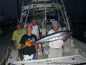 Chip Berry, Harrison Grady, Jim Grady, and Tom Primm with a 45 lb. wahoo they hooked while trolling near the Same 'Ol Hole. They were fishing aboard the "Coastal Plane" out of Carolina Beach.