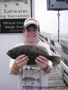 Caleb Sullivan with a 1 lb. 10 oz. flounder caught while fishing from Ocean Crest Pier.