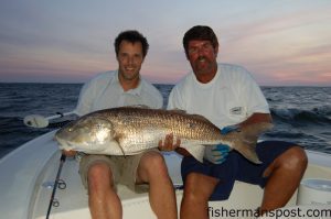 Gary Hurley and Capt. Charles Brown with a 47" red drum caught on a large chunk of cut mullet fished on the drop-off of an oyster rock near the intersection of the Neuse River and Pamlico Sound.