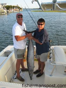 Jack Swart and Mike Green, from Swansboro with a 57 lb. wahoo caught at the SW corjner of the Big Rock on a blue-white skirted ballyhoo. They  were fishing aboard a 23' Parker, and weighed the fish in at Dudley's Marina.