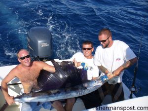 Capt. Lynn Perry, Andy Trant, and Carl Allen with a sailfish caught and released in 150' of water off Wrightsville Beach aboard the "Shearwater."