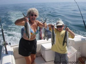 Mary Whitehurst and her grandson Layton Whitehurst with a handful of spanish mackerel taken a mile off Masonboro Inlet on trolled Clarkspoons. They were fishing with Clay Whitehurst aboard the "Buddy Row."