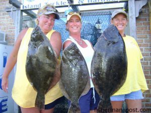 Vicki Boyd, Paula Lee, and Teresa Lomas, of Carolina Beach, with a trio of fat flounder weighing 5.4, 4, and 7.1 lbs. They hooked the fish on live baits while fishing in the Cape Fear River with John Lomas. Photo courtesy of Island Tackle and Hardware.