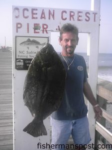 Jeff King, from Southport, with an 8 lb. 11 oz. (29.5" long) flounder. Weighed at Ocean Crest Pier.