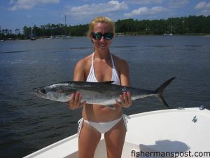 Lelia Tighe with her first king mackerel. It was caught on a live pogy while slow trolling near Yaupon Reef with Chris Keel aboard the "Shortfinn."