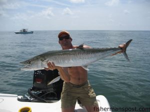 Capt. Travis Dant, of Wilmington, with an estimated 35 lb. king mackerel caught on a live pogy in the propwash while slow trolling in the Cape Fear River channel. The big king was released after the fight.