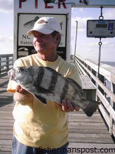 Manuel Bryant, from Oak Island, with a 3 lb. 6 oz. black drum caught while fishing from Ocean Crest Pier.