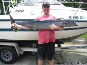 Philip Roesel with a 50 lb. wahoo caught on a pink-skirted cigar minnow at AR-382 in 60' of water. He landed the fish on 20 lb. test while fishing with his father, Frank.