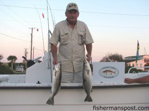 Paul Heath, of Snow Hill, with a pair of specks including the 5.34 lb. fish that is leading the Chasin Tails Speckled Trout Challenge. The fish were caught in the Haystacks on a live shrimp fished under a float rig.
