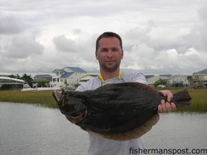 Deryl Ennis, of Charlotte, with a 7.89 lb. flounder he hooked on a live mullet behind Ocean Isle Beach.