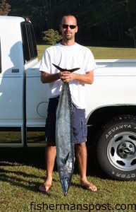 Cory Norville with a 28.2 lb. wahoo caught around the Grouper Hole while he was fishing with his dad Curt on their 20' Bertam.