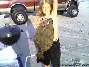 Katlyn Hodge (age 11), from Wilmington, with a 4.3 lb. flounder caught on cut mullet from the north end of Carolina Beach.