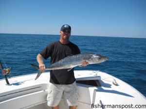 Jeff Parker, of Hampstead, NC, with his first king mackerel. He hooked the king near Frying Pan Tower while fishing with Capt. Bill Zeron aboard the "Bottom Line."