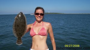 Paige Blair with a flounder she caught near the Duke Marine docks in the hook of Cape Lookout on a Carolina-rigged pogy. She was fishign with Dan, Alyce, and Ayden McDonald and Greg Blair.