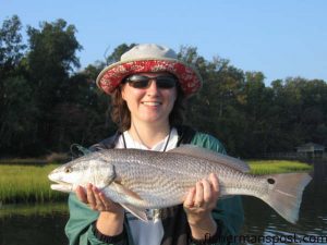 Nicki Mitchell, of Raleigh, with a 25" red drum caught on a spinnerbait/Gulp combination near Surf City while she was fishing with Capt. Todd Streeter of Chasin' Tail Charters.