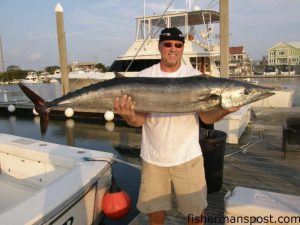 Tad Thomas, from Wilmington, with a 44 lb. wahoo he caught while fishing with Curtis Camp, Steve Bunch, and Capt. Mel Miller aboard the "Ma Ra II." The 'hoo fell for a blue-skirted ballyhoo in aroun 200' 70 miles off Wrightsville Beach.