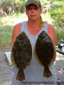 Teresa Coley, from kannapolis, NC, with a couple of flounder caught on cut bait in the Carolina Beach Inlet.
