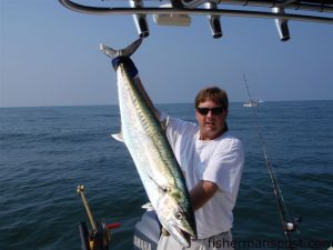 Michael Davis, of Party Suppliers of Wilmington, with a 40 lb. king mackerel caught and released at Yaupon Reef on a live pogy.     