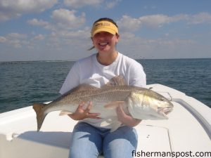 Jessica Griggs, of Hartsville, SC, with a citation red drum caught on a live mullet drifted in Little River Inlet. She was fishing with Capt. Kyle Hughes, of Speckulator Charters out of Ocean Isle Fishing Center.