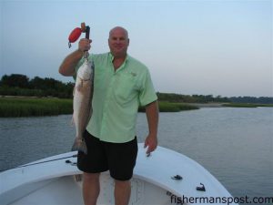 Gary Robbies, from Ohio, with a red drum he hooked on a live finger mullet in the ICW near Little River. He was fishing with Capt. Patrick Kelly of Capt. Smiley's Fishing Charters out of North Myrtle Beach.