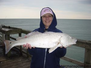 Wanda Taylor, of Kernersville, NC, with her first red drum, a 26”, 7+ lb. fish caught on a live finger mullet from the Carolina Beach Pier.  