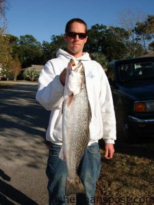 Josh Brown, from Wilmington, with a 7 lb. 6 oz. speckled trout that fell for a Purple Demon MirrOlure after dark near Masonboro Inlet.