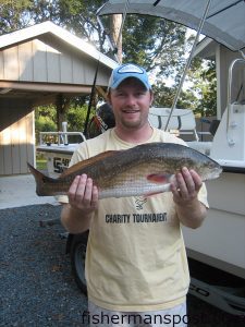 Will Monroe, from Raleigh, NC, with a red drum caught on a finger mullet in the ICW between Oak Island and Southport.