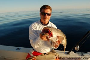 Tim Barefoot shows off the desired (and often received) results when a baited Decoy jig is dropped to an offshore ledge.