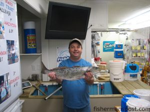 Tim "Trout Man" Fletcher with a 7 lb. speckled trout he caught at Cape Lookout at night while casting a silver Rapala Subwalk in February.