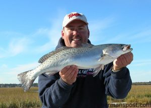 Capt. Jot Owens with a fat speckled trout that fell for a good penny colored Blurp shrimp near Masonboro Inlet.