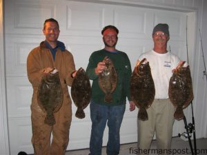 Dr. Matt Fentress, Capt. Nick Miller and Mark Miller with flounder they hooked off Carolina Beach in early January. The largest fish was a citation 5.04 pounder.