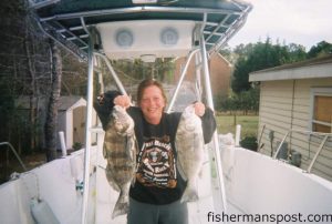 Constance Holohan, from Wilmington, with a pair of black drum weighing 6 and 3 lbs. she caught on squid heads while fishing with her husband John aboard the "Pop A Top."