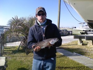 Kevin Collie, from Fayetteville, NC, with a 3 lb. speckled trout he hooked while fishing near Swansboro with Capt. Jeff Cronk of Fish'N4Life Charters.