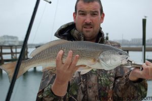 Max Gaspeny with a 23" red drum that fell for a jighead/shrimp combination underneath a Wrightsville Beach dock while fishing with Capt. Mike Hoffman of Corona Daze Charters.
