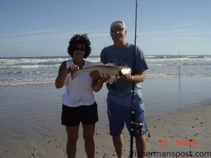 Diane and Mike Dowd with a slot red drum caught in the Topsail surf on cut bait.