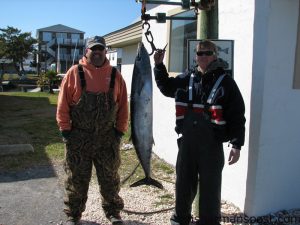 Scott Edwards and Barry McClure with a 44 lb. wahoo caught on a ballyhoo underneath a pink Bluewater Candy Mini Jag while trolling the Gulf Stream. Weighed at Chasin Tails Outdoors.
