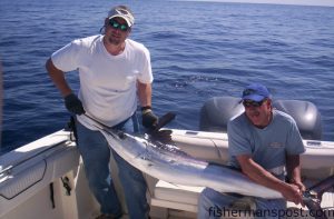 Bryan Worsley, of Mocksville, NC, and Greg Rufenacht, of Harkers Island, NC, with a white marlin they hooked in 180' just north of the Blackjack Hole. The white bit a ballyhoo under a blue/crystal witch while they were fishing aboard  the "Fish Tank" with Terry Logan of Oak Island.